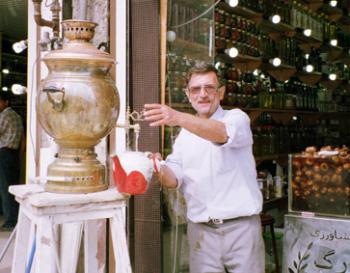 Shop owner pouring tea in a small town north of Tehran. Photo by Arlene Mikkelsen