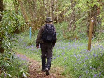 My husband, Randy Poteet, walking past a marking post on the Kintyre Way in Scotland. Photo by Sally Schoenberg