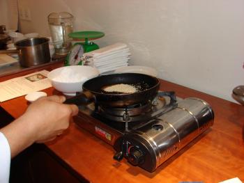 Lightly browning the sesame seeds. Photo by Sandra Scott