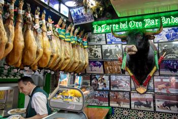 Tapas bars proudly hang ham hocks — and bullfighting memorabilia — as part of the decor.