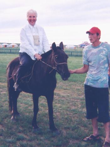 Lorna Tjaden on a horse in Mongolia.